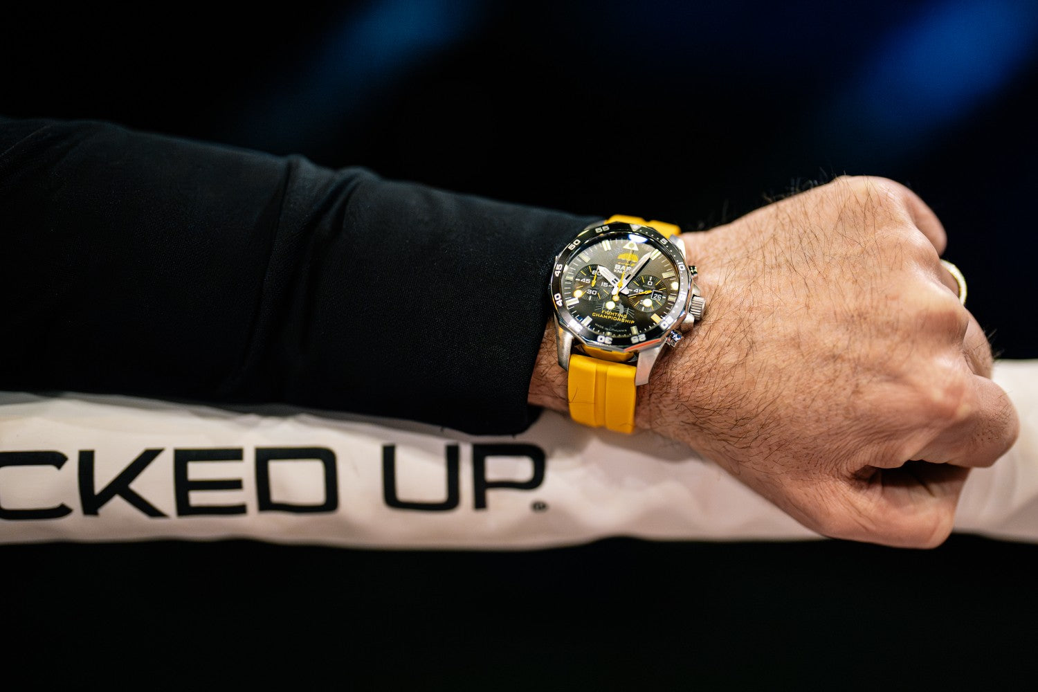 Vostok Europe x BKFC limited-edition 46 mm quartz chronograph with black dial and yellow silicone strap worn ringside