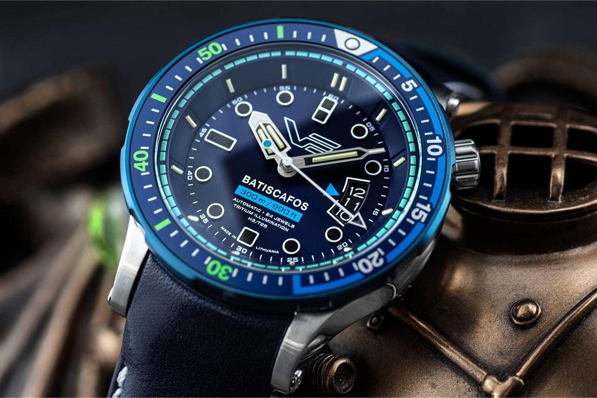Vostok Europe Batiscafos NH35-511E768 blue dial dive watch next to a vintage brass diving helmet
